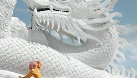 White Dragon Statue and Tourist, Thailand